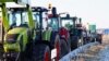 Agricultorii germani protestează împotriva reducerii subvențiilor.