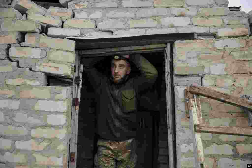 A Ukrainian soldier looks on at the front line near Chasiv Yar, Donetsk region, Ukraine.