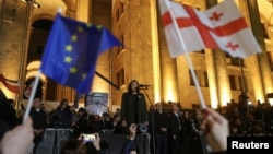 Georgian President Salome Zurabishvili addresses protesters outside the Georgian parliament after disputed elections on October 28. 