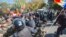 Moldovan police clash with demonstrators during a protest against the government outside the parliament building in Chisinau on October 4.