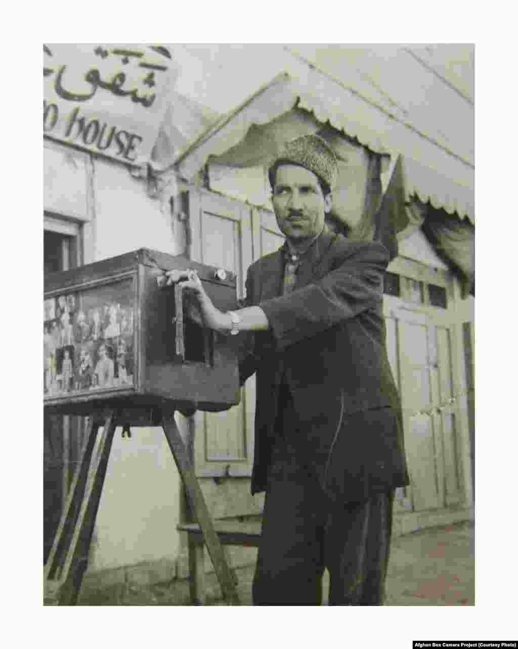 DO NOT USE -- EMBARGOED -- this file can be used by the press in promoting the book, AFGHAN BOX CAMERA. -- 2_Abdul Samad with his box camera. Kabul 1950s/1960s They may not be used in any other context without first acquiring permission from the Afghan Bo