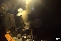 A screen grab from a video released by the US Central Command on June 11 shows what the American military says were strikes aimed at Iranian targets.