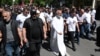 Armenian protesters -- led by Archbishop Bagrat Galstanian (center right) -- march through Yerevan on May 10.