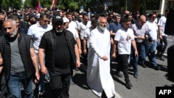 Armenian protesters -- led by Archbishop Bagrat Galstanian (center right) -- march through Yerevan on May 10.