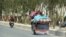 An Afghan family flees the fighting in Kandahar on July 10.