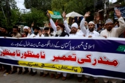 Members of a Sunni religious group protest against the construction of the Hindu temple at a demonstration in Lahore on July 12.