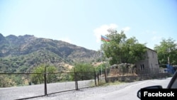 An Azerbaijani flag is seen on the Goris-Kapan road section controlled by Baku; the photograph from the Armenian ombudsman's Facebook account,19Sep,2021