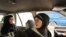 A female taxi driver fetches a passenger in Tehran, 21Aug2011