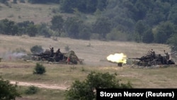 Bulgarian soldiers fire during the Strike Back 21 military drill at the Koren training grounds in Bulgaria in 2021.