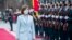 Maia Sandu reviews the honor guard in front of the presidential building after her inauguration ceremony i​n Chisinau, Moldova.