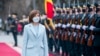 Maia Sandu reviews the honor guard in front of the presidential building after her inauguration ceremony i​n Chisinau, Moldova.