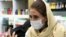 Iran - a woman wears a mask during the coronavirus epidemic - screen grab Reuters