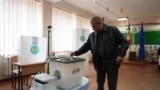 A man voted in the Nov. 16, 2025 local elections, including in villages among the first to undergo amalgamation.