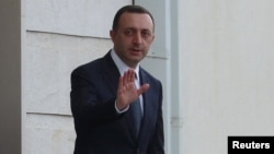 ირაკლი ღარიბაშვილი სასამართლო სხდომას არ დასწრებია - ის თავს დამნაშავედ არ ცნობს.