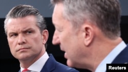 US Secretary of Defense Pete Hegseth (left) and General Dan Caine, chairman of the Joint Chiefs of Staff, hold a briefing on the Iran war at the Pentagon.