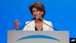 CEO of French gas and power group Engie Isabelle Kocher gestures as she speaks during the shareholder meeting of the group in Paris, France, Friday, May 18, 2018. (AP Photo/Michel Euler)