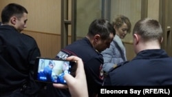 Anastasia Shevchenko is seen in the defendant's cage in a courtroom in Rostov-on-Don on January 23.