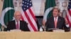 U.S. Secretary of State John Kerry (R) speaks with Pakistani Foreign Affairs Advisor Sartaj Aziz during at the US State Department in Washington, on February 29.