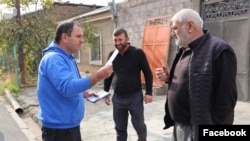 Armenia - Sevak Khachatrian (left), the leader of the opposition Victory bloc, campaigns for a local election, November 12, 2025.