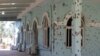 Bullet holes are seen on the wall of a mosque at an A mosque inside the Afghan military base where Taliban assailants killed scores of soldiers on April 21.