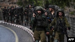 Vojnici izraelske vojske patroliraju neutvrđenim područjem na sjeveru Izraela na granici s Libanom 15. oktobra 2023.