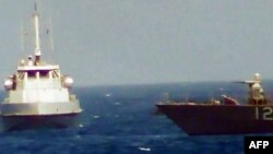 An Iranian boat heads toward a U.S. patrol craft on July 25. Another incident occurred on July 28.