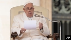 Pope Francis delivers his speech during his weekly general audience in St. Peter's Square at the Vatican on March 13.