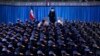 Iranian Supreme Leader Ayatollah Ali Khamenei stands as army air force staff salute at the start of their meeting in Tehran, February 8, 2019