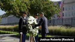 U.S. President Barack Obama places a wreath during a ceremony marking the 15th anniversary of the 9/11 attacks at the Pentagon in Washington, U.S., September 11, 2016.