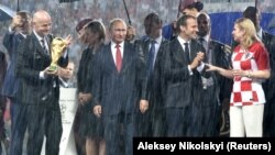 Russian President Vladimir Putin (center) and French President Emmanuel Macron (2nd right) last met during the World Cup in Russia this summer, when France won the tournament.