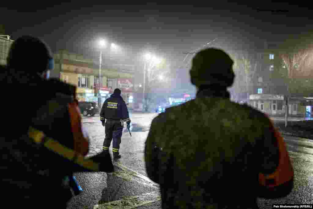 Armed separatists patrol the streets of Donetsk.