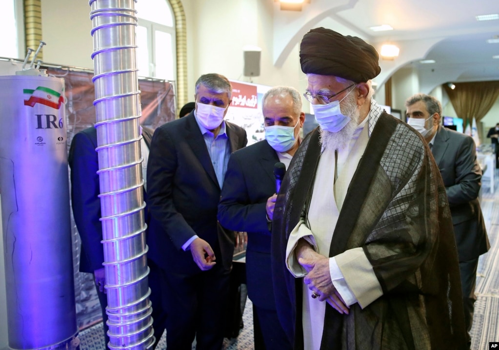 Supreme Leader Ayatollah Ali Khamenei (right) visits an exhibition of Iran's nuclear achievements at his office compound in Tehran in June 2023.