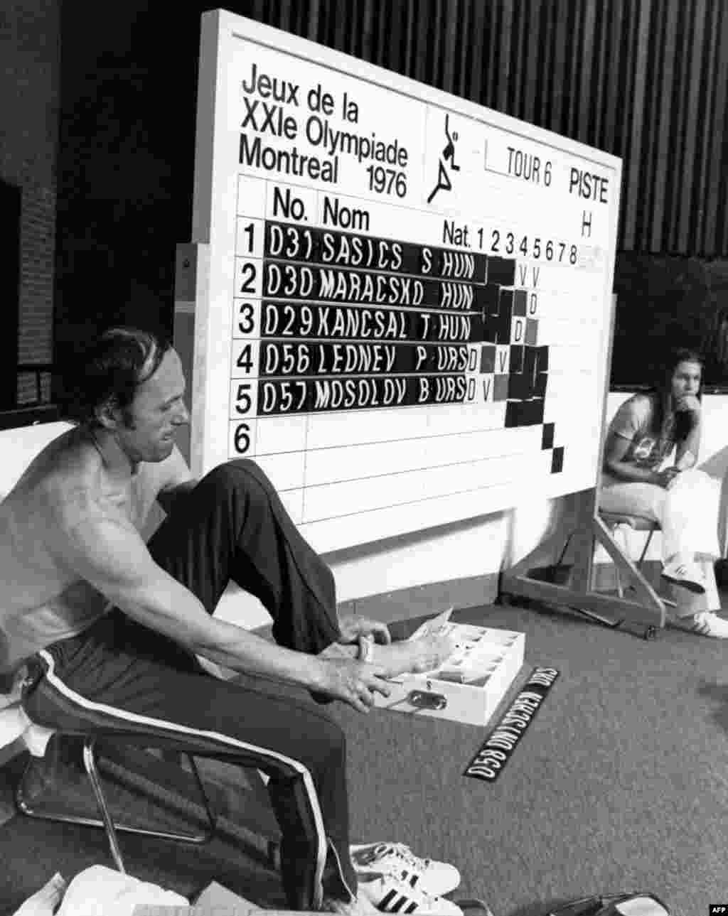 Soviet fencer Boris Onischenko puts on his socks after he was disqualified because he had manipulated his sword in the fencing event during the Summer Olympic Games in Montreal in 1976.