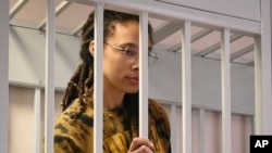 WNBA star and two-time Olympic gold medalist Brittney Griner stands in a cage at a court room prior to a hearing at the Khimki district court, just outside Moscow on July 15.