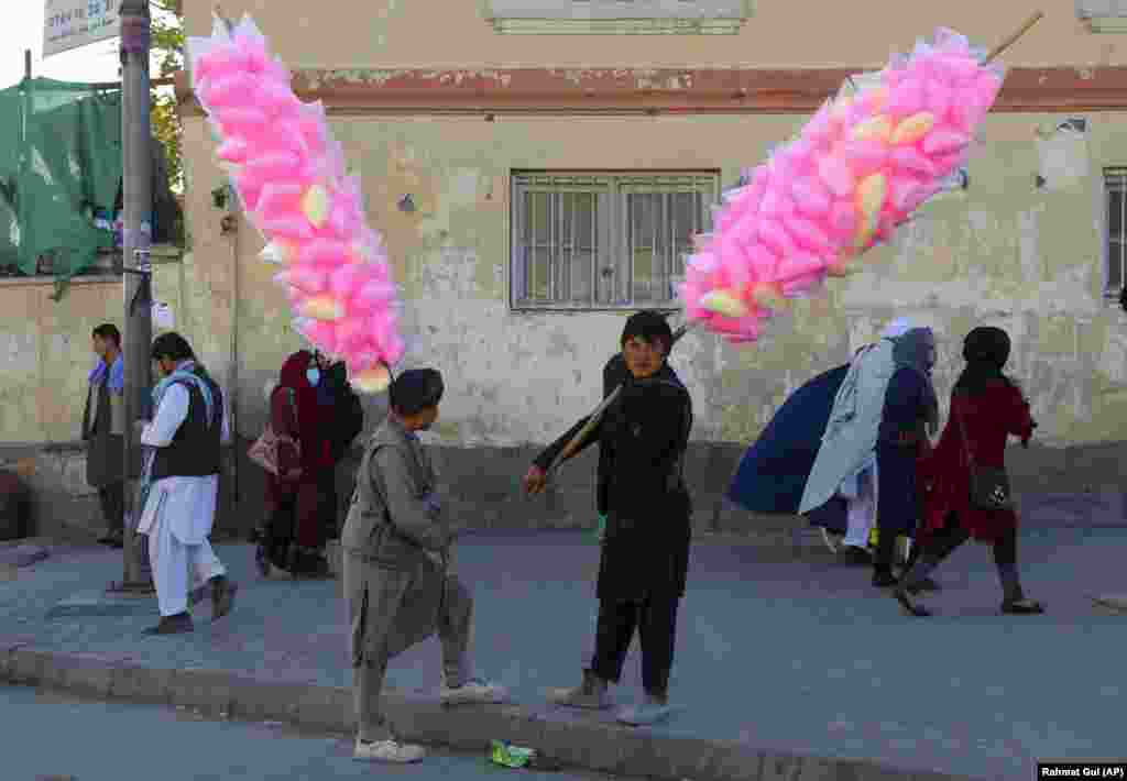 Vendors selling cotton candy wait for customers in Kabul. (AP/Rahmat Gul)