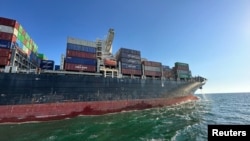 The Hong Kong-flagged container ship Joseph Schulte leaves the sea port of Odesa on August 16.