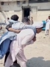 Suicide Attack On Police Facility In Northwest Pakistan Leaves Many Dead And Wounded