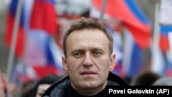  РОССИЯ - Активист российской оппозиции Алексей Навальный принимает участие в марше памяти лидера оппозиции Бориса Немцова в Москве, Россия, в воскресенье, 24 февраля 2019 г.