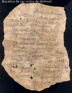 The secret note with political prisoners' names written in charcoal that was found inside the casino wall.