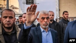 Yahya Sinwar waves to supporters during a rally in the Gaza Strip in April 2023.