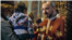 Priest in an Orthodox Church in Romania gives the Holy Communion to a child