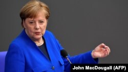 German Chancellor Angela Merkel answers questions from members at the Bundestag, the lower house of parliament, in Berlin on May 13.