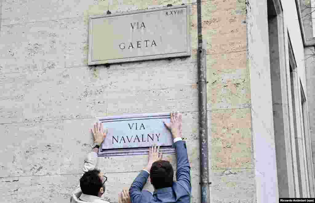 Activists put up a mock street sign outside the Russian Embassy in Rome, Italy, in March 2024, after the death of Russian opposition activist Aleksei Navalny.