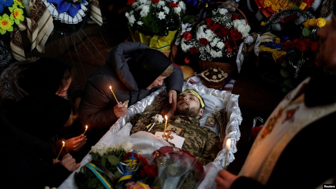 The funeral of Ukrainian decathlete and soldier Volodymyr Androshchuk in Letychiv, Ukraine, on February 1