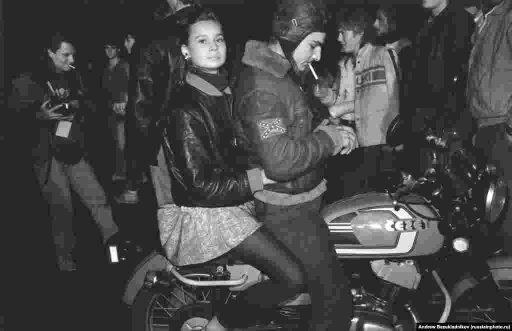 The kids are Russian, the motorbike is Czech, but the flag is Confederate: Bikers on the streets of Moscow in 1989.&nbsp;