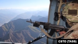 Troops from the Collective Security Treaty Organization inspect the area near the Tajik-Afghan border in July.