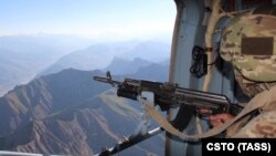 A soldier from the Collective Security Treaty Organization military bloc inspects the area near the Tajik-Afghan border.