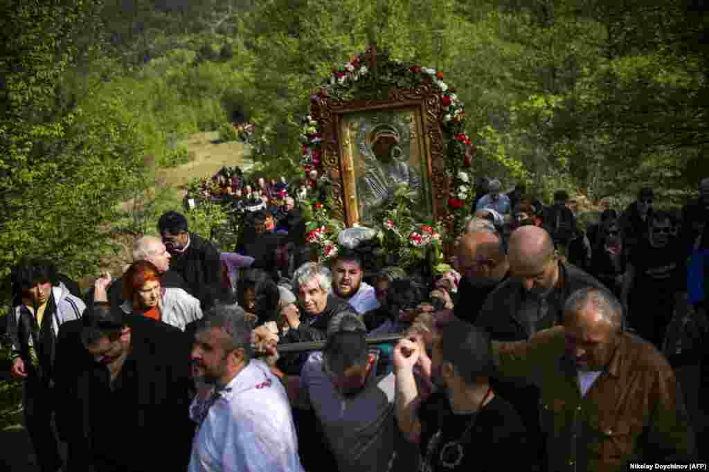 Pilgrims carry an icon of the Virgin Mary during the annual religious procession, marking the second day of Orthodox Easter at the Bachkovo monastery in Bulgaria on April 29. (AFP/Nikolay Doychinov)