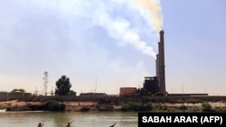 Iraq -- A general view shows a Baghdad's electricity power station in al-Dora neighborhood on September 29, 2013. Although there is an improvement in Iraq's power grid supplied by 29 stations across the country, Baghdad's power supply remains intermittent