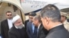 Telangana state Governor E.S.L. Narasimhan shakes hands with Iranian President Hassan Rohani (2L) upon his arrival at Begumpet airport in Hyderabad, India on February 15.